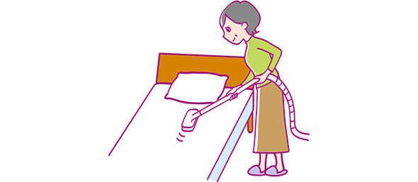 イメージ：布団カバーの表面を掃除機で吸引する女性のイラスト