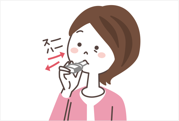 イメージ:ブリーズヘラー®を口につけたまま吸ったり吐いたりしている