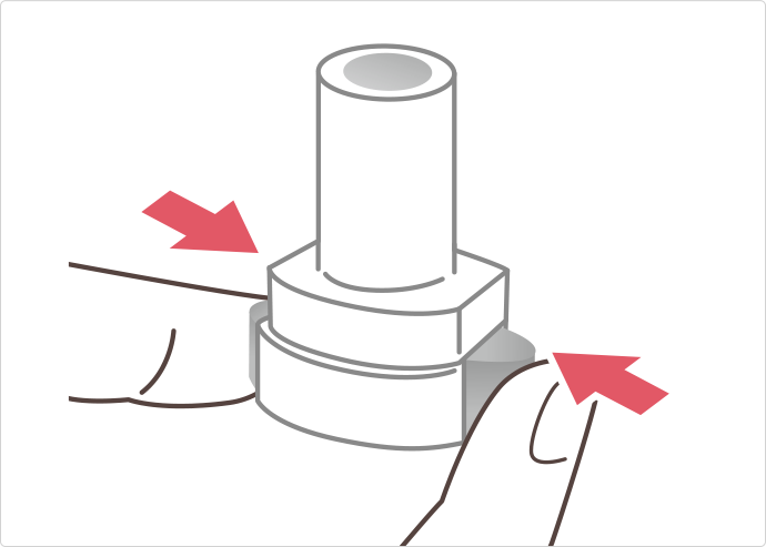 イメージ：両側のボタンをしっかり押し、離す
